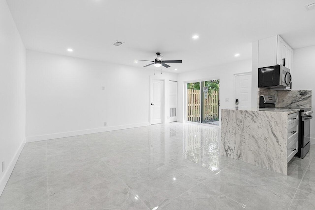 interior space featuring ceiling fan