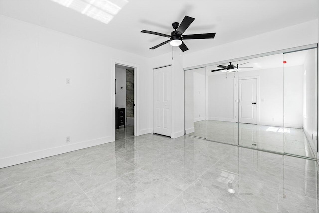 unfurnished bedroom with ceiling fan and light tile patterned floors