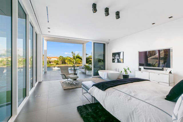 bedroom featuring expansive windows