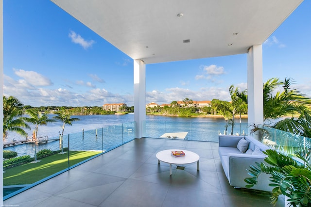 view of patio / terrace featuring a balcony and a water view