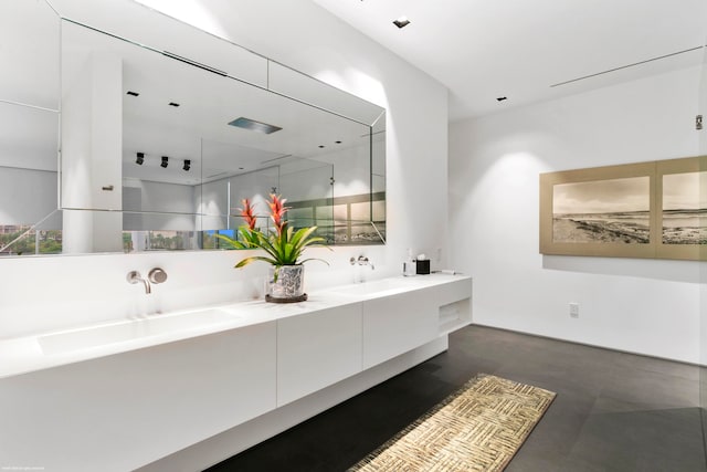 bathroom featuring vanity and concrete floors