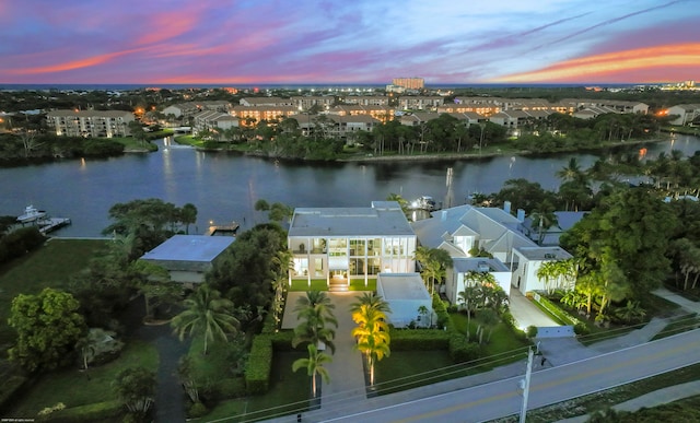 aerial view at dusk with a water view