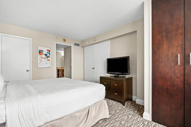 bedroom featuring light carpet, baseboards, and visible vents