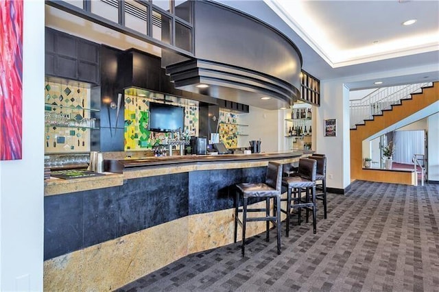 bar with carpet floors, stairs, wet bar, and recessed lighting