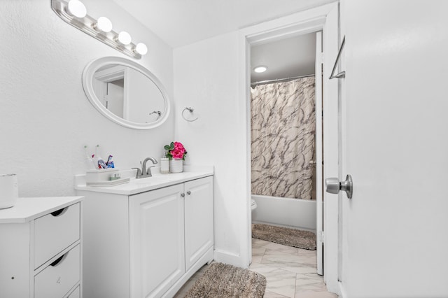 full bathroom with shower / tub combo, vanity, and toilet