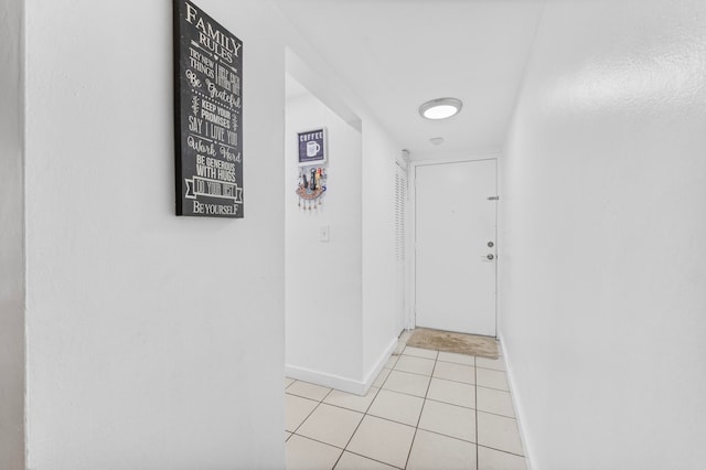 hallway featuring light tile patterned floors