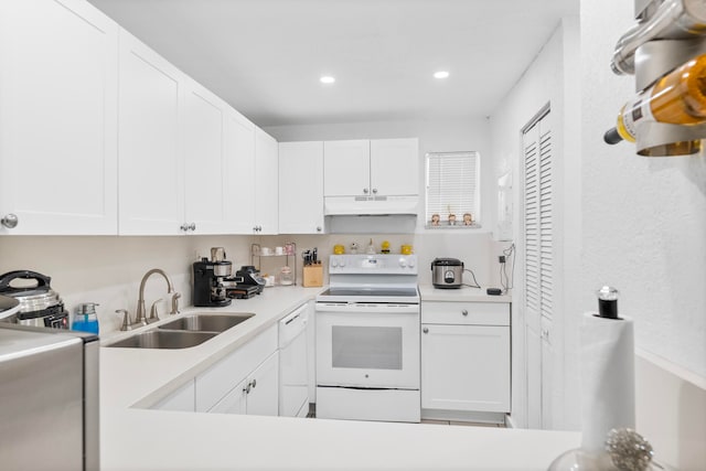 kitchen featuring white cabinets, sink, and white appliances