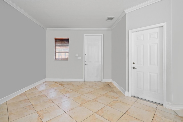 entryway featuring light tile patterned floors and crown molding