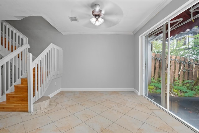 unfurnished room with crown molding, light tile patterned flooring, and ceiling fan