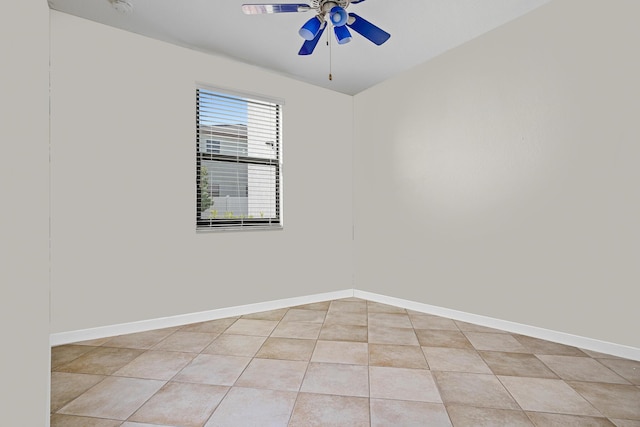 tiled empty room with ceiling fan