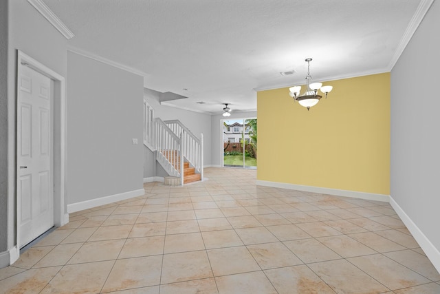 tiled spare room with ceiling fan with notable chandelier and ornamental molding