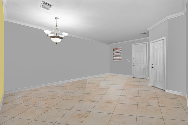 tiled spare room with crown molding and a chandelier