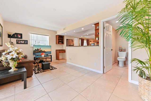 262 Monaco F, Delray Beach, FL 33446 - living room with light tile patterned flooring, recessed lighting, and baseboards