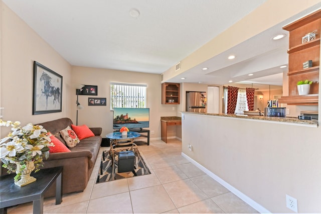 living room with light tile patterned floors