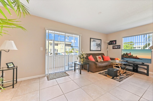 262 Monaco F, Delray Beach, FL 33446 - living room featuring baseboards and tile patterned floors