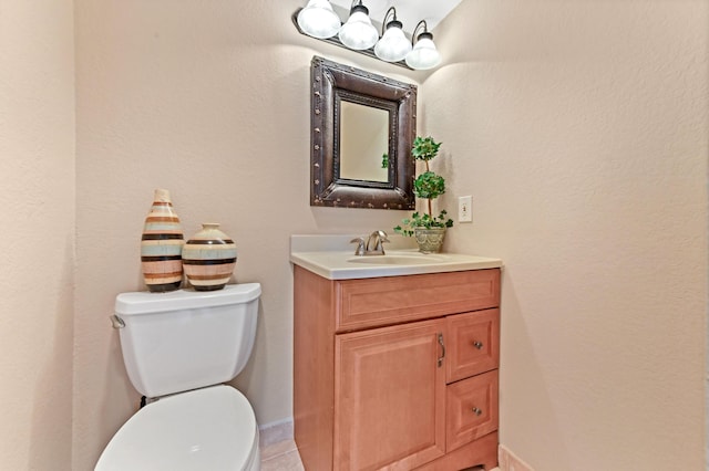 262 Monaco F, Delray Beach, FL 33446 - bathroom featuring toilet, vanity, baseboards, and tile patterned floors