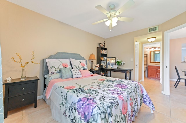 tiled bedroom with connected bathroom and ceiling fan