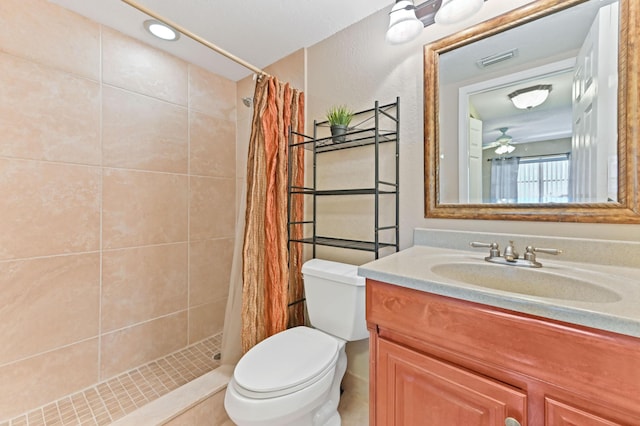 262 Monaco F, Delray Beach, FL 33446 - bathroom featuring toilet, vanity, and tiled shower