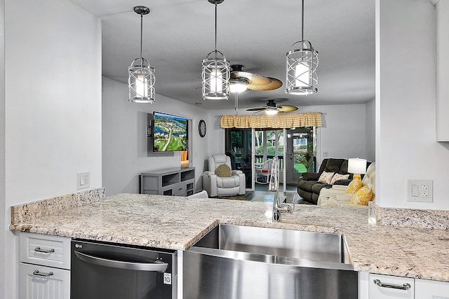 kitchen featuring dishwasher, pendant lighting, light stone countertops, and ceiling fan