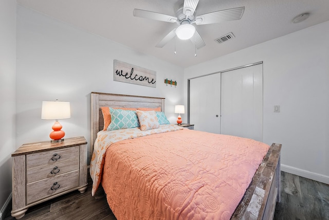 bedroom with a closet, ceiling fan, and dark hardwood / wood-style floors