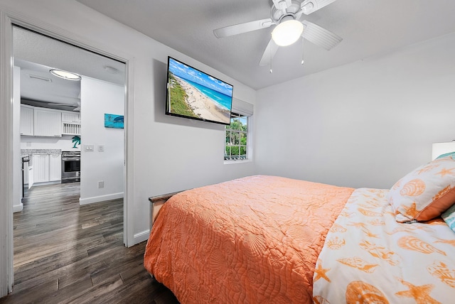 bedroom with ceiling fan and dark hardwood / wood-style floors