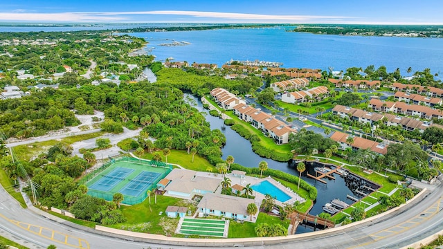 birds eye view of property with a water view