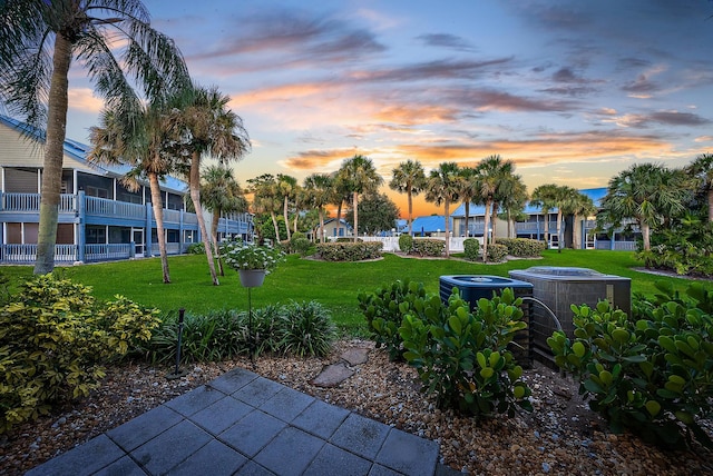 view of home's community with a lawn