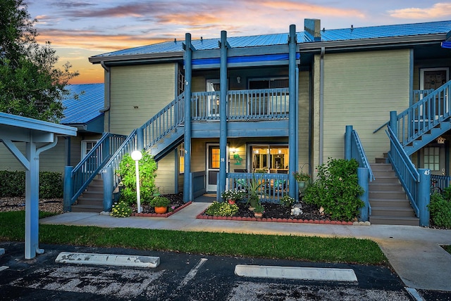 view of back house at dusk