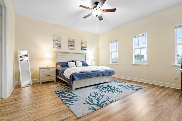 bedroom featuring light wood-type flooring and ceiling fan