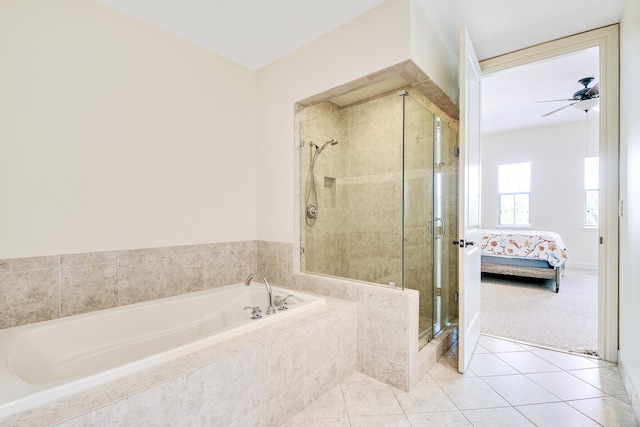 bathroom with shower with separate bathtub, ceiling fan, and tile patterned floors