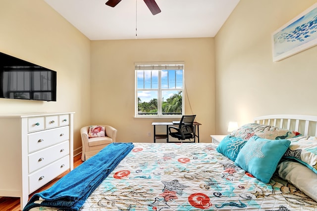 bedroom with hardwood / wood-style floors and ceiling fan