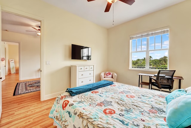 bedroom featuring ceiling fan and light hardwood / wood-style floors