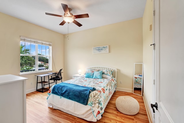 bedroom with light wood-type flooring and ceiling fan