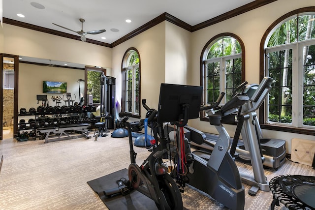 exercise room featuring a ceiling fan, carpet, crown molding, and recessed lighting