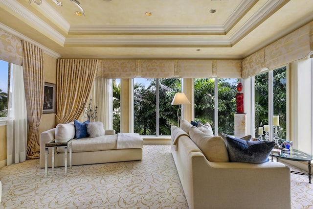 sunroom / solarium with a raised ceiling