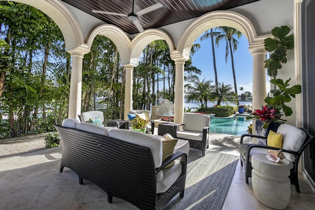 view of patio with ceiling fan, outdoor lounge area, and an outdoor pool