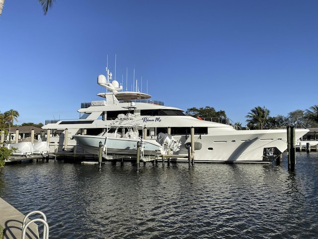 view of dock featuring a water view and boat lift