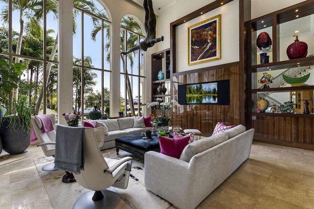 living room with a towering ceiling