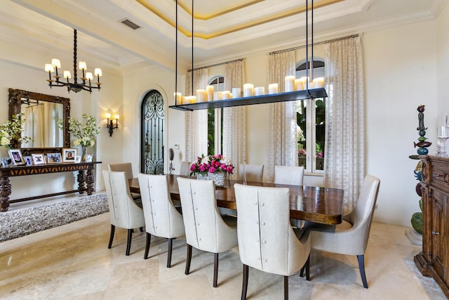 dining area with a tray ceiling, arched walkways, a notable chandelier, crown molding, and visible vents