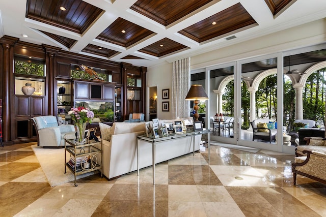 living area with crown molding, a high ceiling, coffered ceiling, and ornate columns