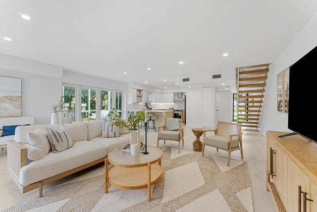 living room with light hardwood / wood-style flooring