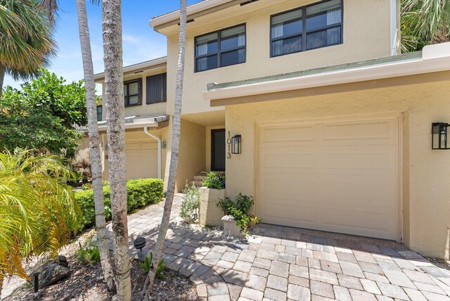 view of front of property featuring a garage