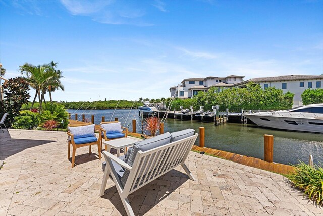 view of patio / terrace featuring a boat dock and a water view