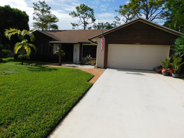 ranch-style house with a front lawn and a garage