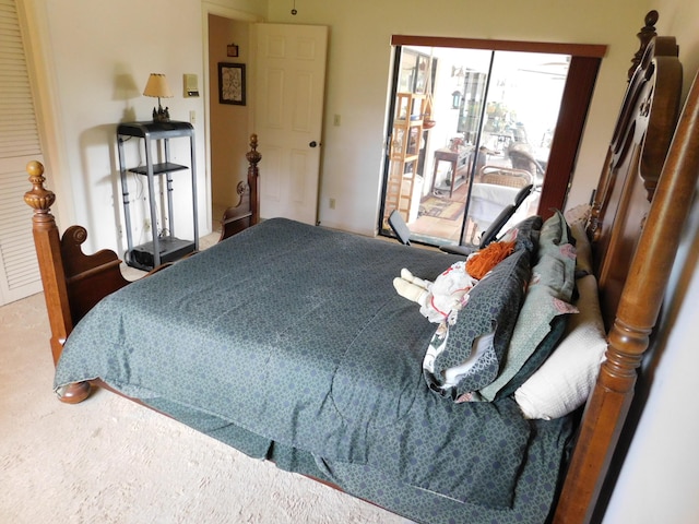 carpeted bedroom featuring access to outside