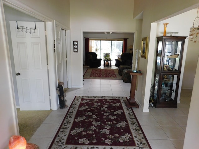 hall featuring light tile patterned flooring