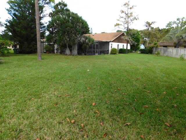 view of yard with a sunroom