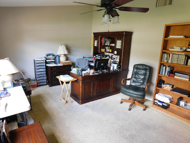 office area with light carpet, vaulted ceiling, and ceiling fan