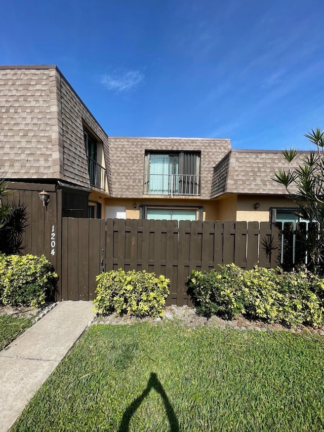 view of side of property with a yard