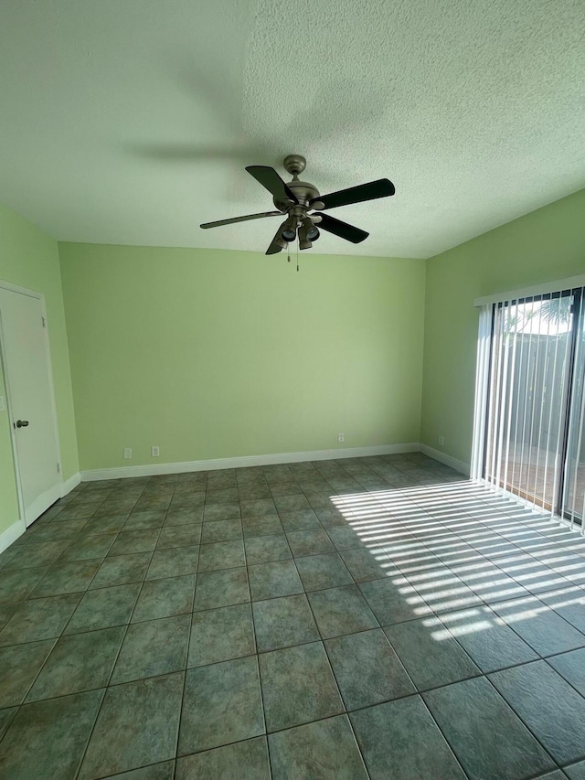 1204 Waterview Cir, Palm Springs, FL 33461 - unfurnished room with a ceiling fan, a textured ceiling, tile patterned flooring, and baseboards
